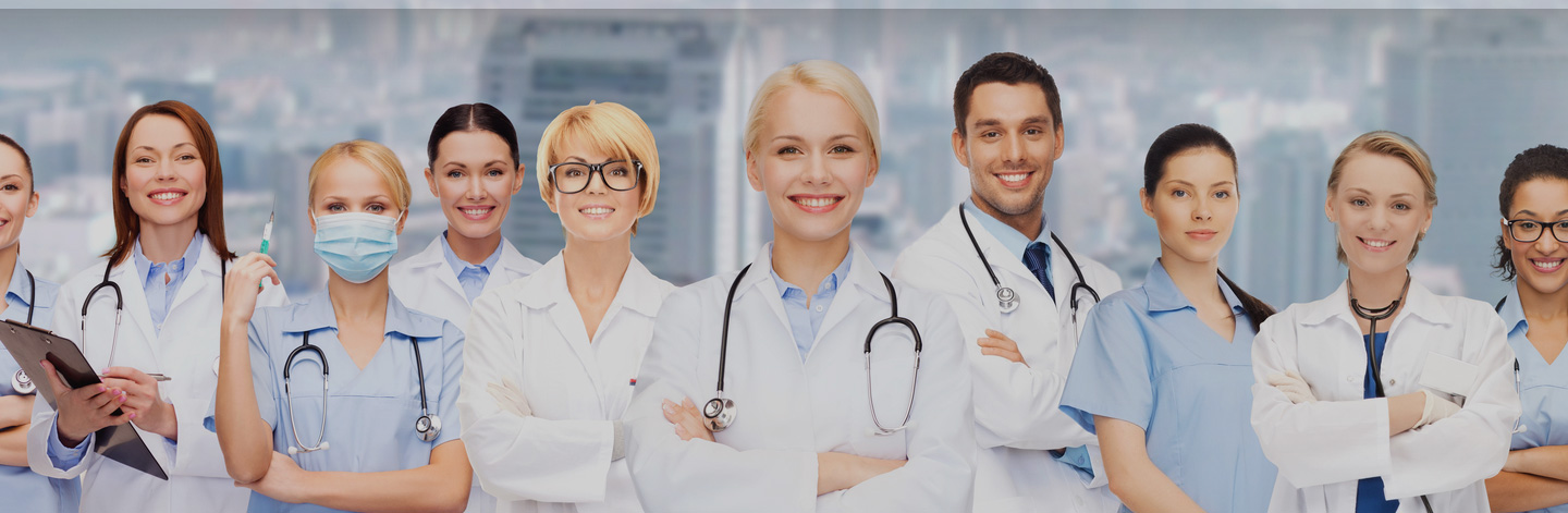 Doctors lined up looking at the camera.