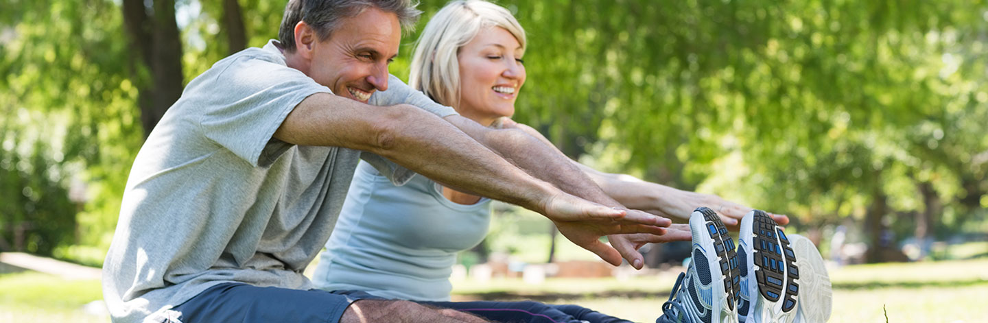 Man and woman stretching.