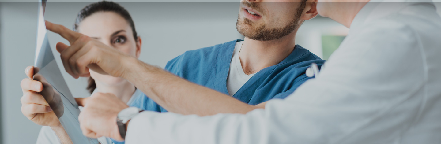 Doctors reviewing a chart.